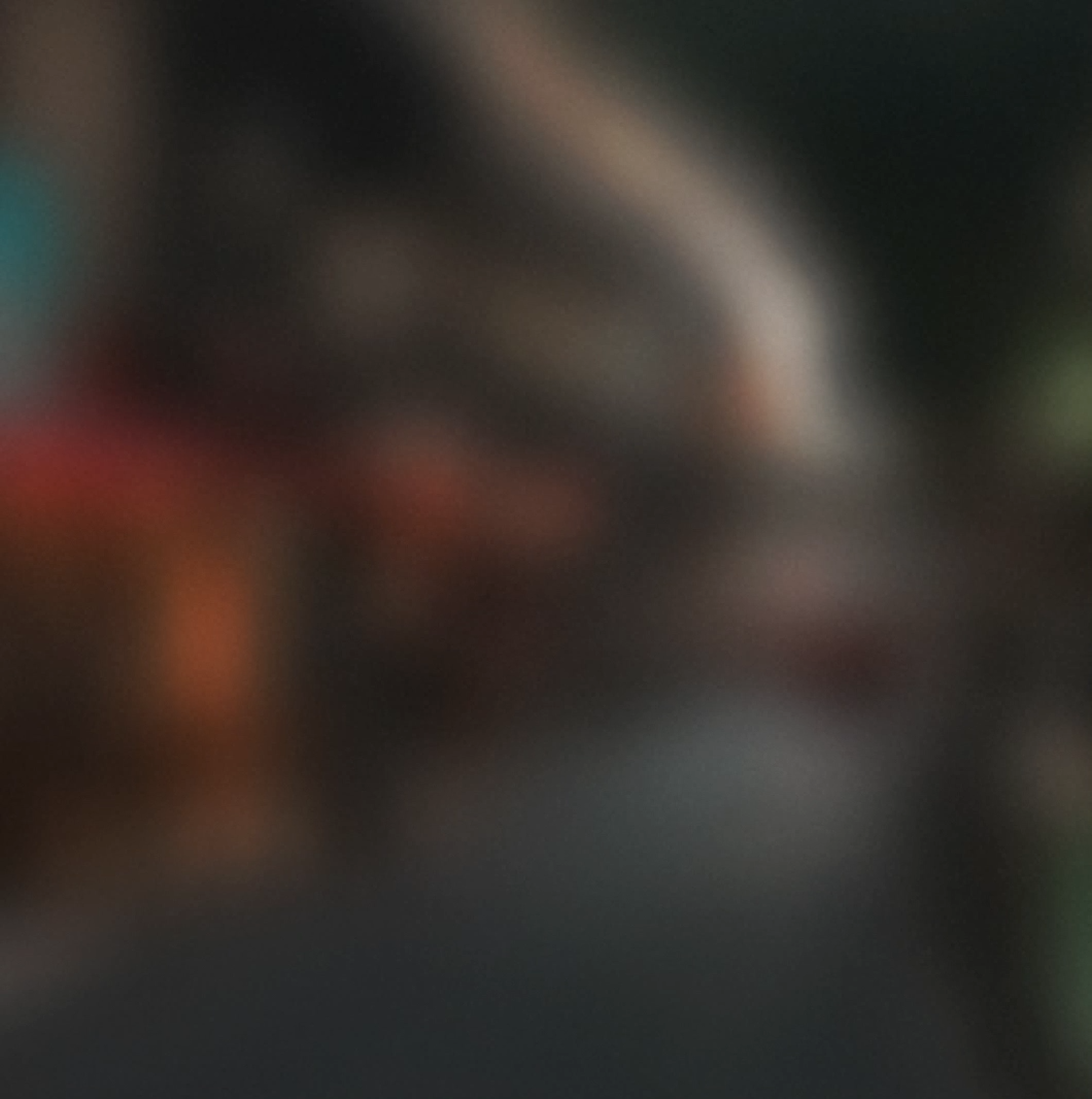 Ambient blurred background — wearing the glasses, ambient scene.